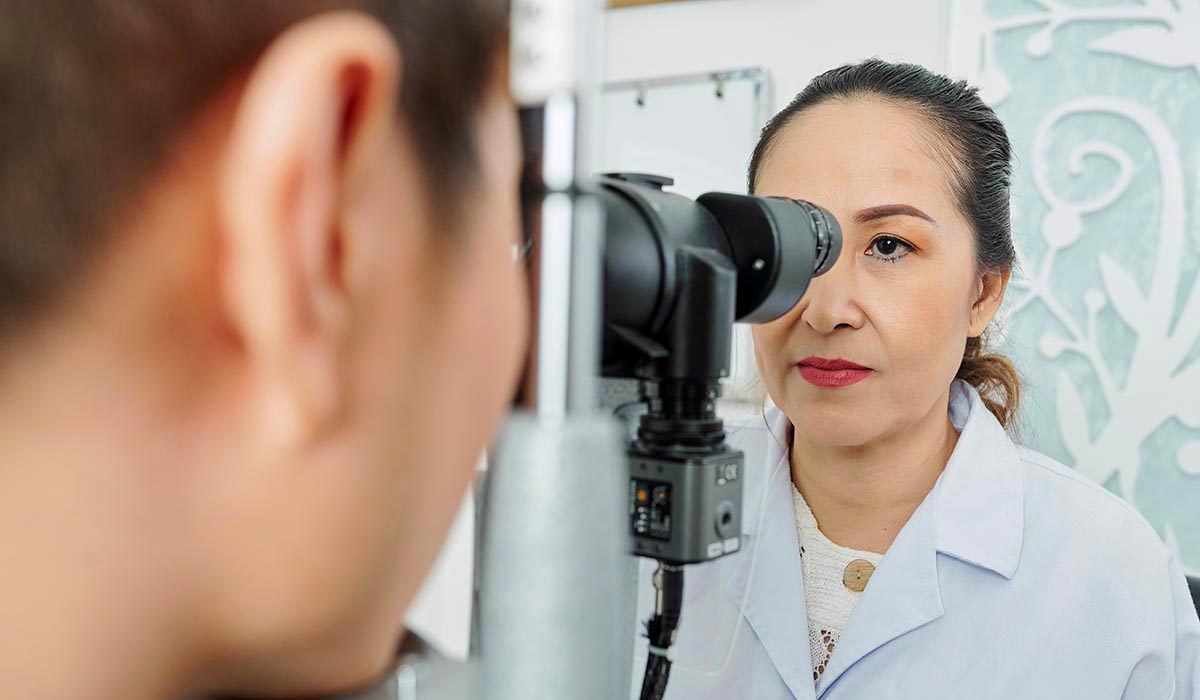 optometrist examining the patient's eyesight