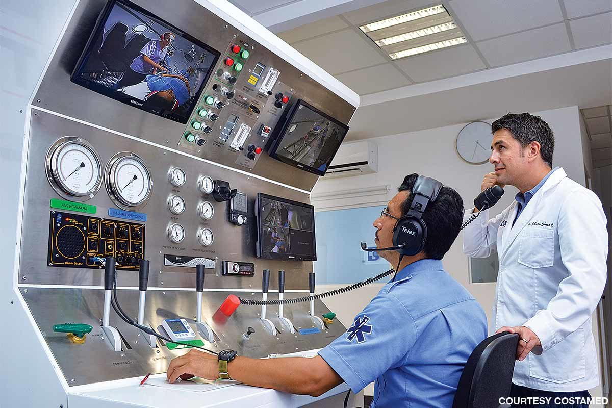 Staff monitors and communicate with patients at the Costamed chamber.