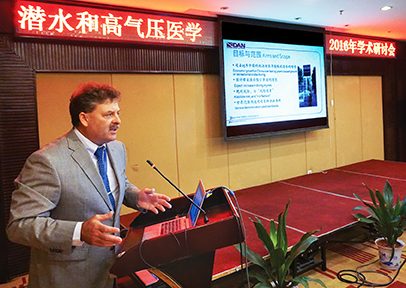 Buzzacott speaks at a dive medicine conference in Shanghai, China