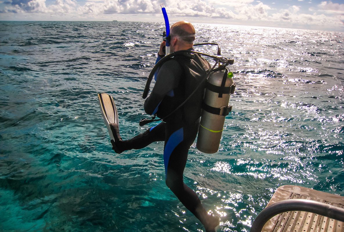 scuba diver performing a giant stride
