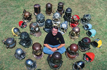 Leaney is surrounded by rare dive helmets
