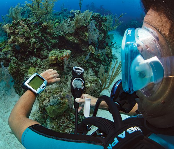 diver checking oxygen level