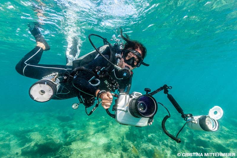 diver with photographic equipment