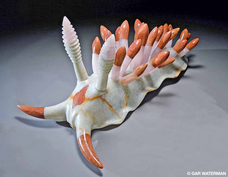 A marble sculpture of a Flabellina nudibranch