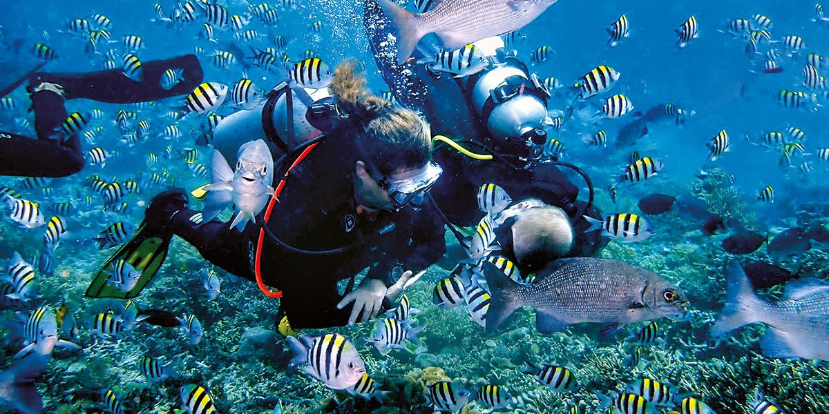 Andrea scuba diving in Indonesia.
