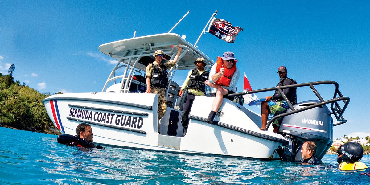 Members of the Bermuda Regiment Coast Guard dive team review a dive plan during a training dive.