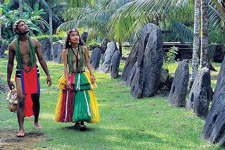 A young couple dressed in traditional attire.