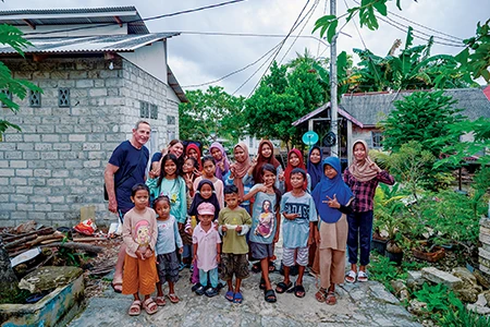 Anita Verde and Peter Marshall visit children from the village of Lamanggau.