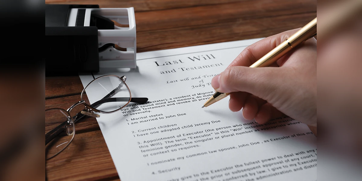 Someone writing Last Will and Testament.