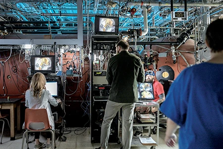 Hess observes the cameras that view the inside of the hyperbaric chamber.