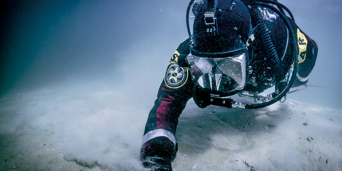 Diver at the ocean floor.