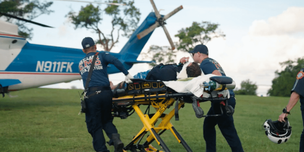 Diver being loaded onto air ambulance.