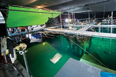 While filming on location in the Berkshires, Massachusetts, the crew preps a boat fefore shooting a close-up of Michael Douglas. © Matt O’Connor.