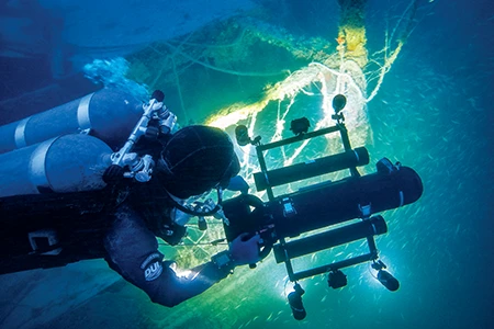 Photogrammetry specialist Roger Lacasse deploys a camera and lighting sled
