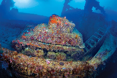 A Japanese Type 97 light tank rests on the deck of the Japanese cargo ship Nippo Maru.