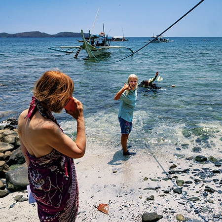 When Marino saw a dive emergency unfolding as a diver struggled to haul an unresponsive dive buddy through the surf to the beach, she signaled for a woman on the beach to dial 911 for assistance.