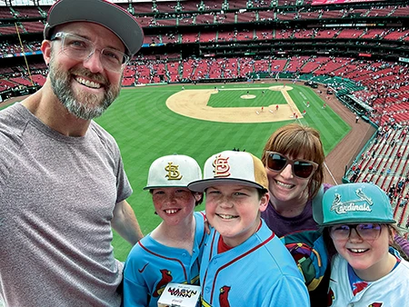 Schlader and his family attend a baseball game.